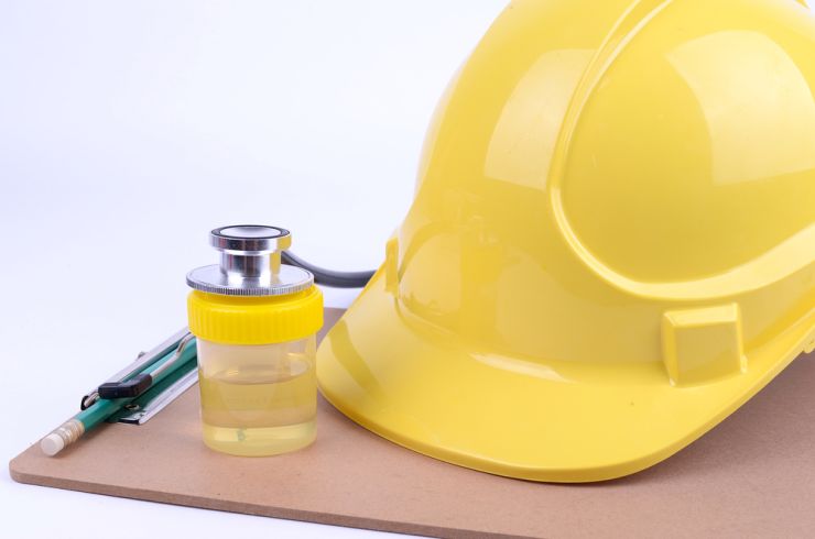 Hard hat, clipboard and urine container